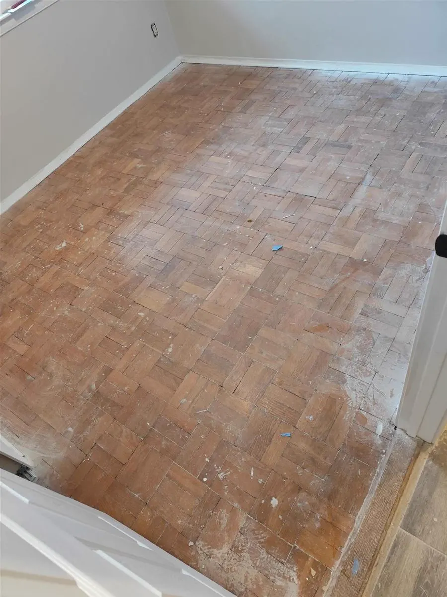 Dull, scuffed parquet floor before refinishing